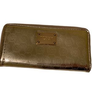 Micheal Kors  large metallic gold patent leather MK monogrammed zip wall…
